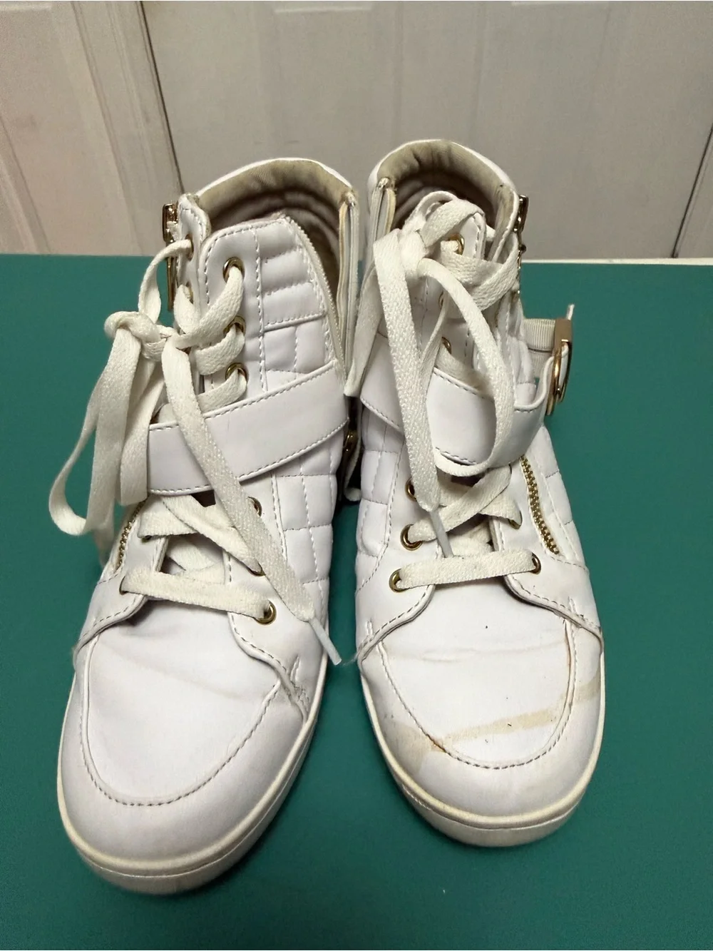 GUESS High-Top Wedge Sneakers in white faux leather.